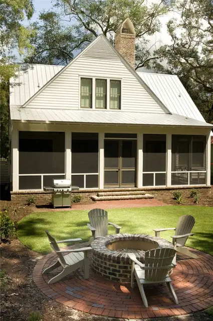 adirondack-chairs-on-round-brick-paving-in-inspiring-backyard-plus-brick-fire-pit
