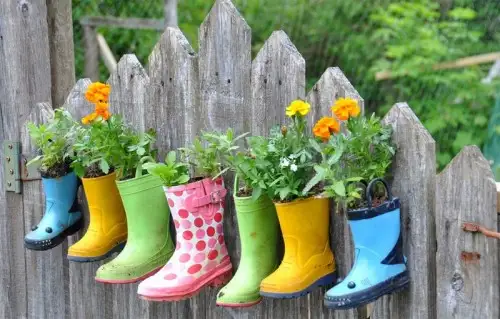 rainboot-garden-on-a-fence