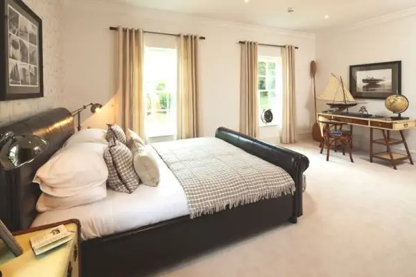 England-property-bedroom-leather-bed