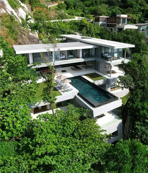 Плавательные бассейны в бетонном доме The Wall House от Guedes Cruz Arquitectos