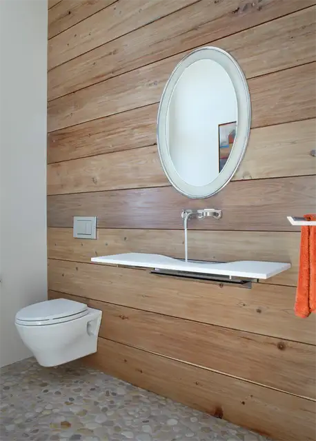 river-rocks-bathroom-floor-with-wall-mounted-toilet