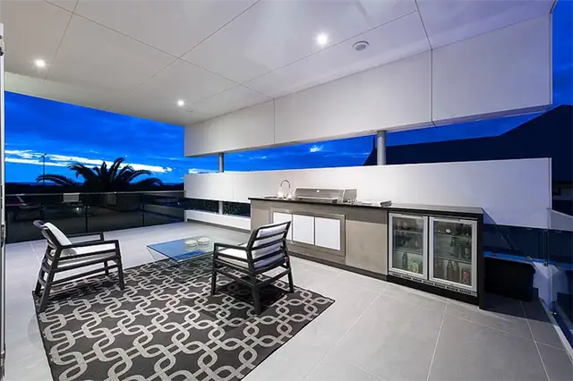 city-beach-house-outdoor-lounge-area-kitchen