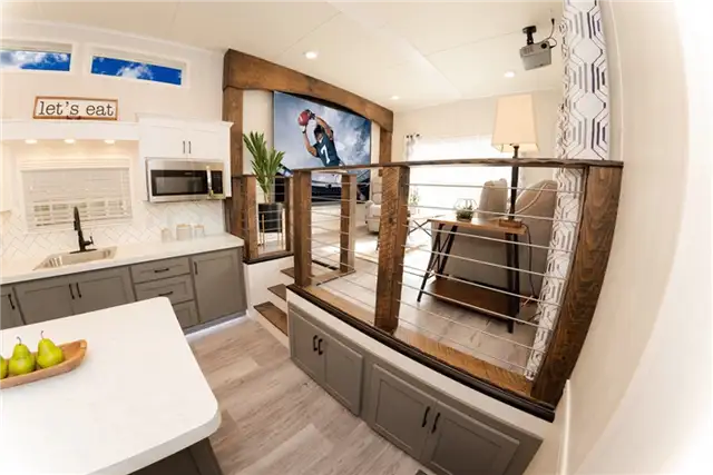 Park Model Homes - Crafts man Large House on Wheels - внутренние перила лестницы