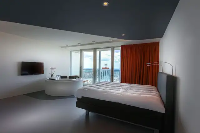 rotterdam-penthouse-master-bedroom-red-curtains