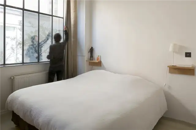 paris-loft-renovation-bedroom-no-headboard