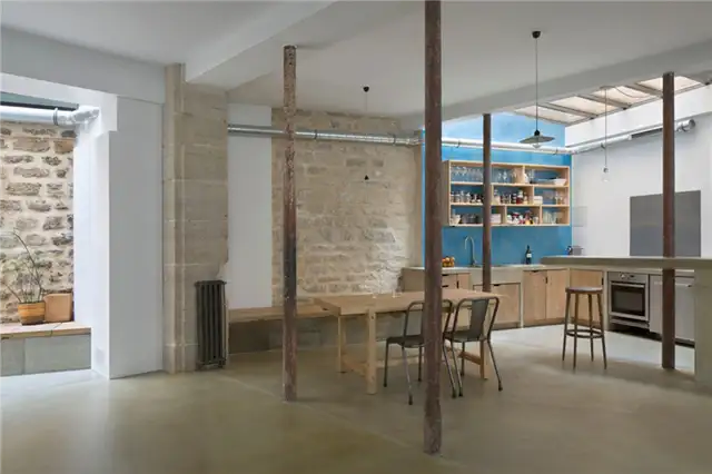 paris-loft-renovation-dining-area-brick-wall